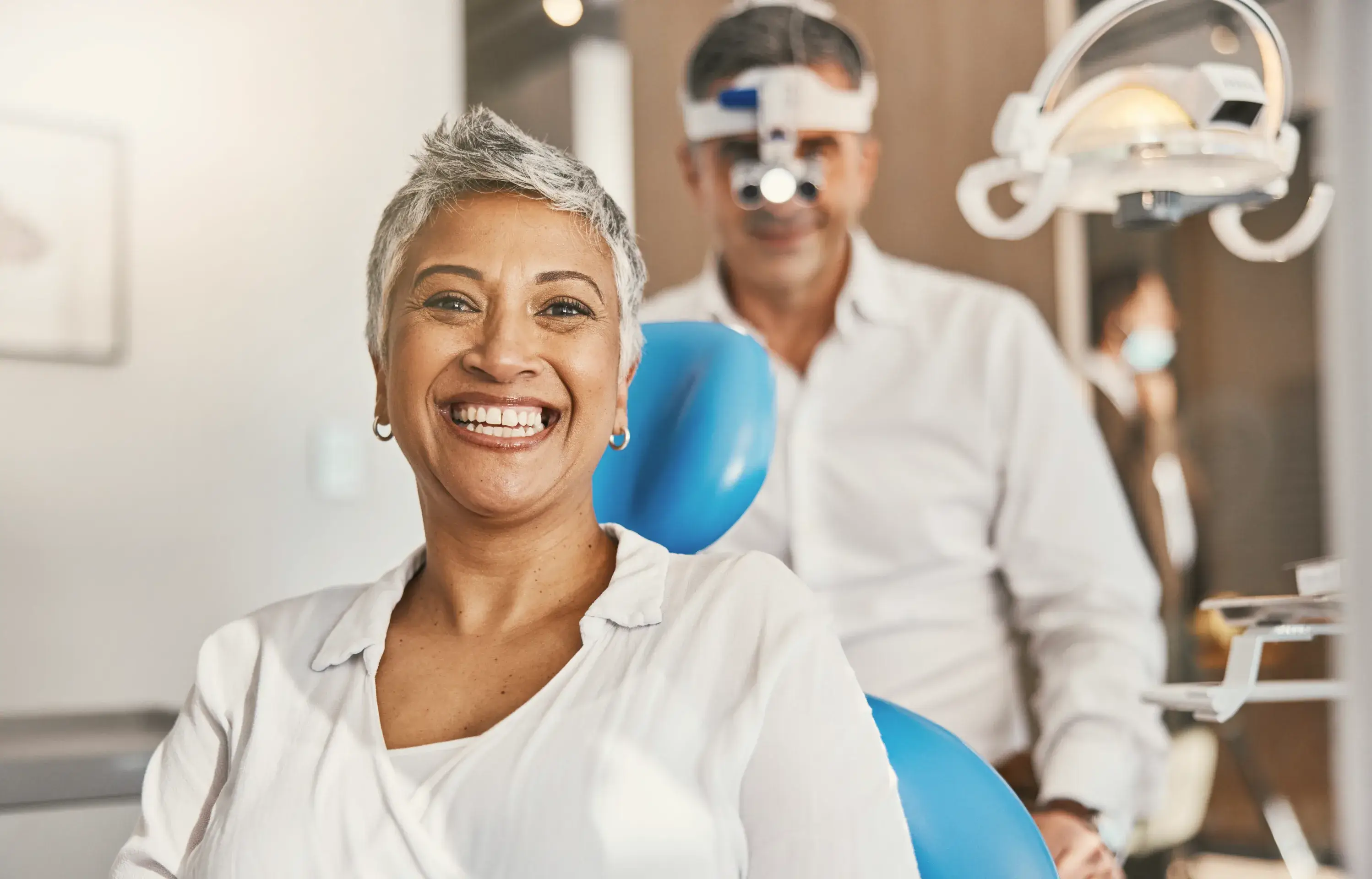 a man and a woman in a dentist's office